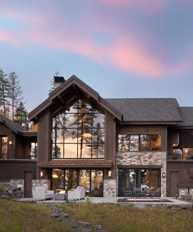 Tate Interiors Montana Interior Design Beargrass Chalet Rear Exterior Dusk Patio