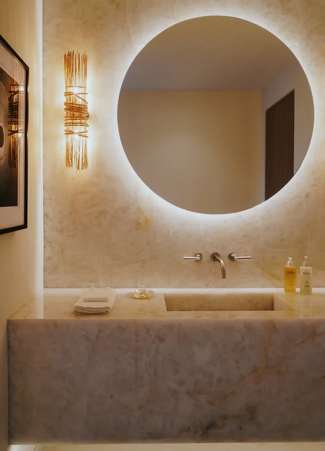 Tate Interiors Montana Interior Design Cabo Powder Room Stone Vanity Round Mirror