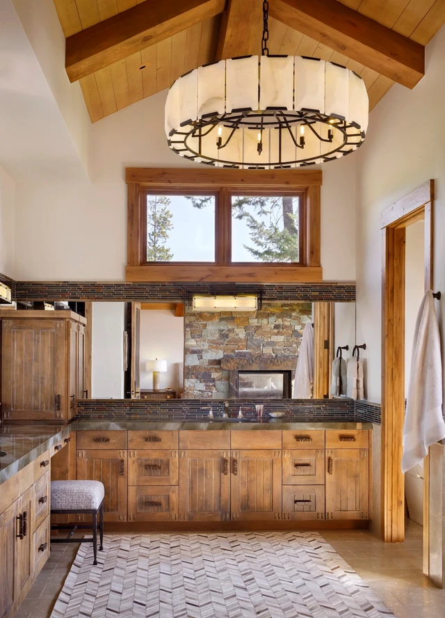 Tate Interiors Montana Interior Design Iron Horse Vacation Home Primary Bath Vanity Stone Fireplace