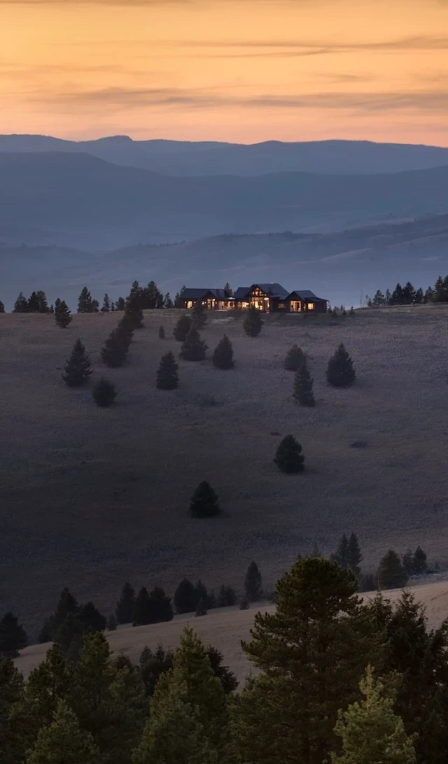 Tate Interiors Montana Interior Design Pintler Shadows Aerial View House On Hillside Dusk