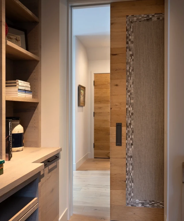 Tate Interiors Montana Interior Design Sisters Cabin Hallway Wood Sliding Door Built In Shelves